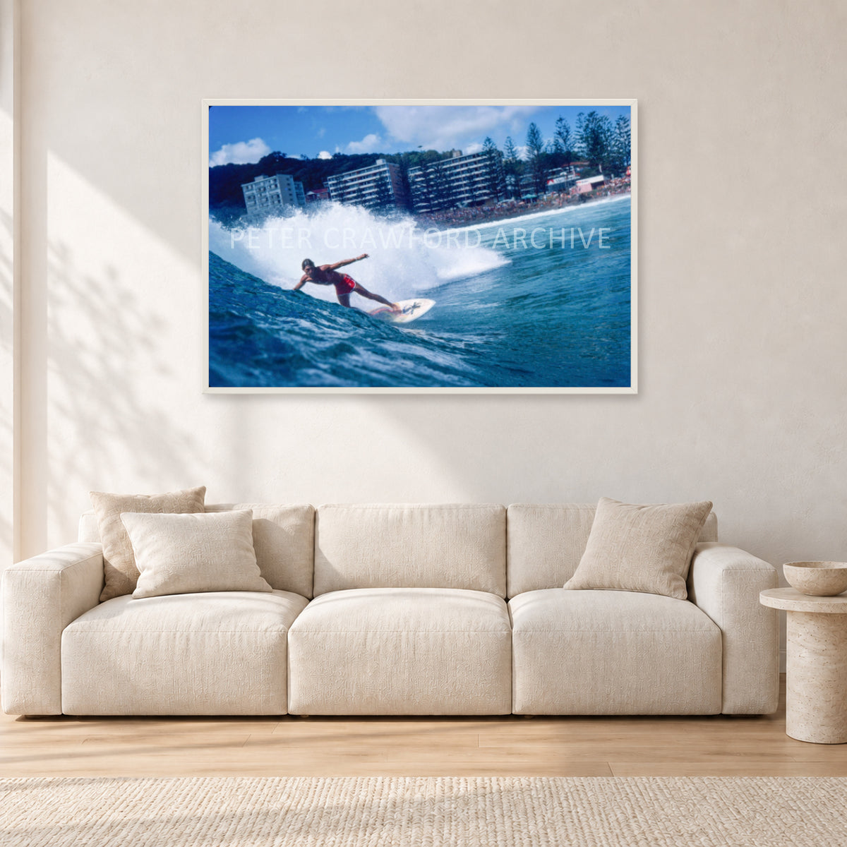 Shaun, Stubbies 1977 by Peter Crawford — 120 × 80 cm, white frame, shown in a light minimalist living room.
