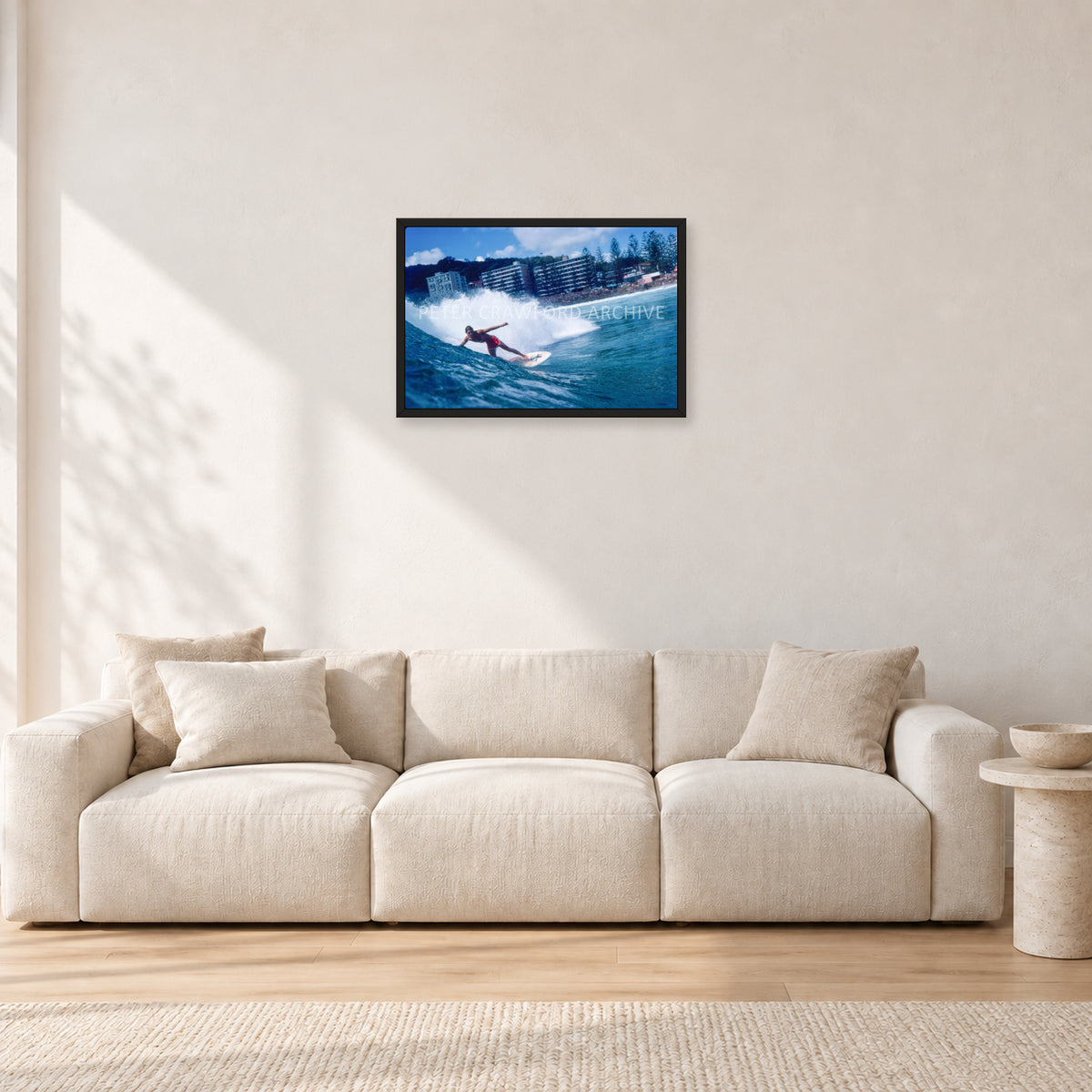 Shaun, Stubbies 1977 by Peter Crawford — 60 × 40 cm, black frame, shown in a light minimalist living room.