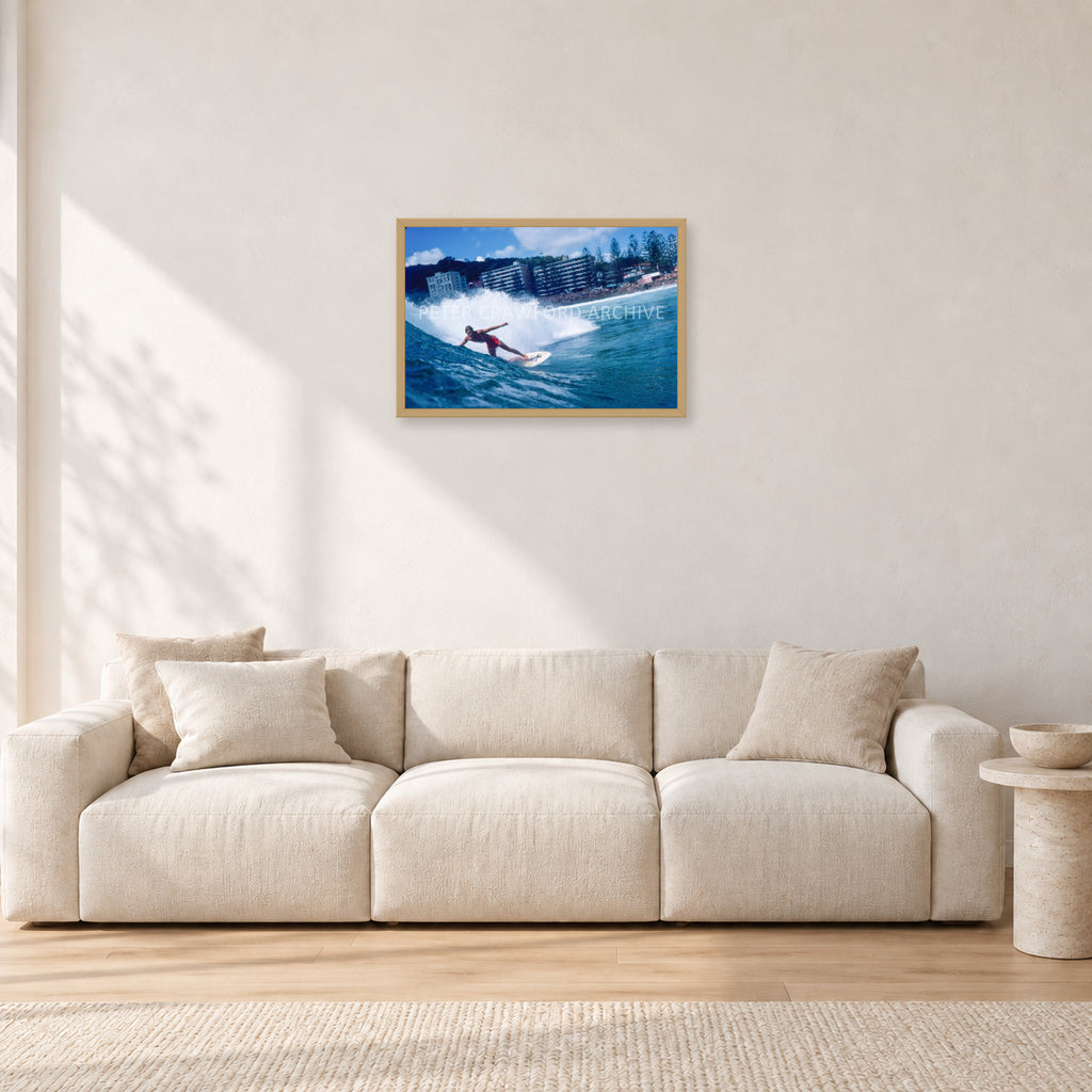 Shaun, Stubbies 1977 by Peter Crawford — 60 × 40 cm, hayseed frame, shown in a light minimalist living room.