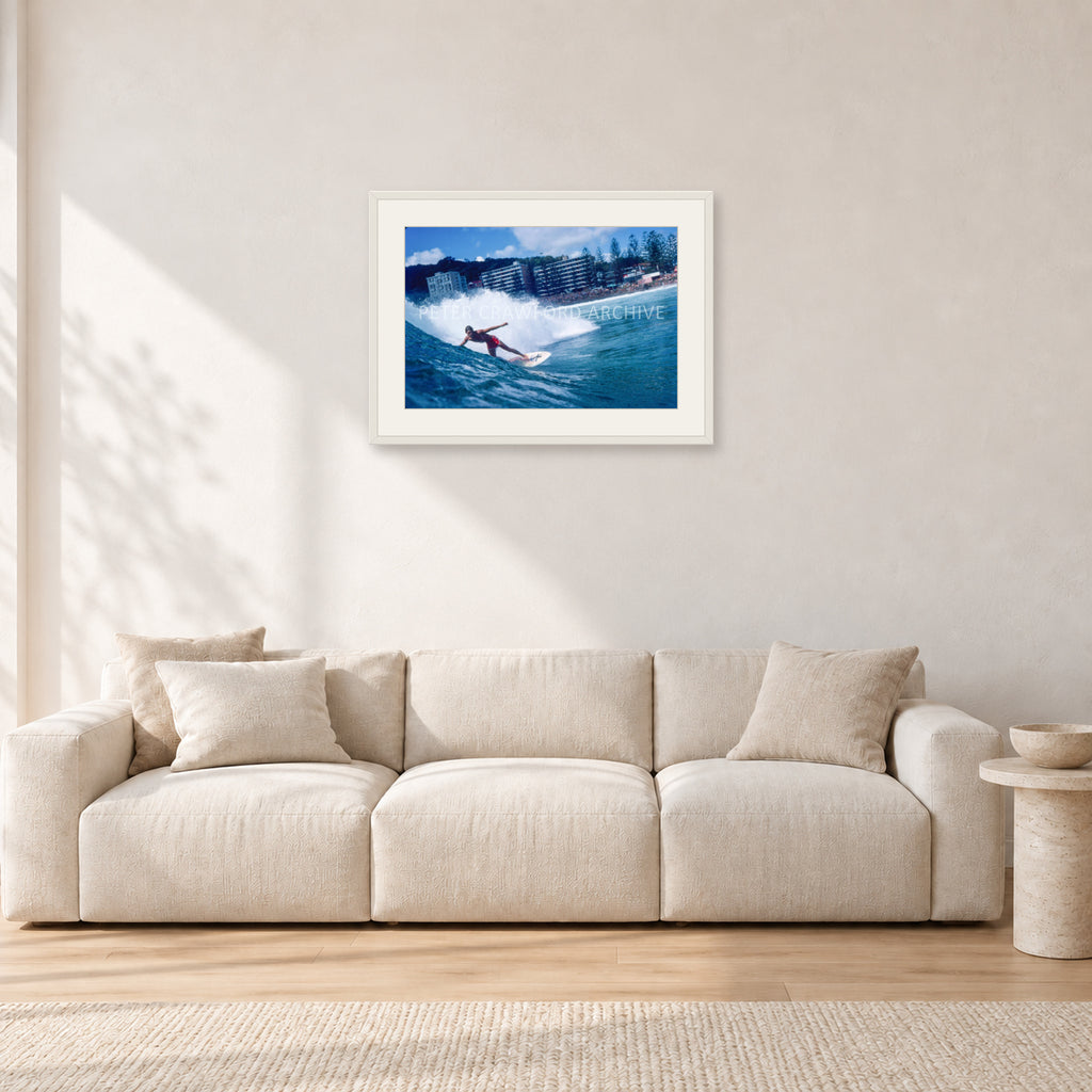 Shaun, Stubbies 1977 by Peter Crawford — 60 × 40 cm, white frame with white mat, shown in a light minimalist living room.