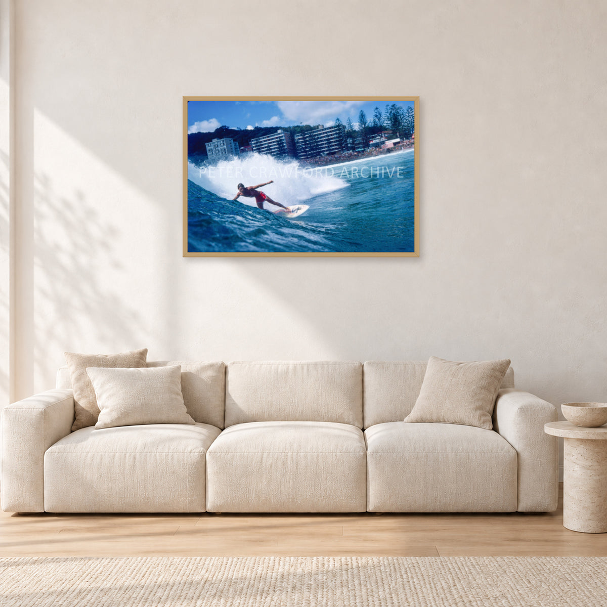 Shaun, Stubbies 1977 by Peter Crawford — 90 × 60 cm, hayseed frame, shown in a light minimalist living room.