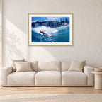 Shaun, Stubbies 1977 by Peter Crawford — 90 × 60 cm, hayseed frame with white mat, shown in a light minimalist living room.