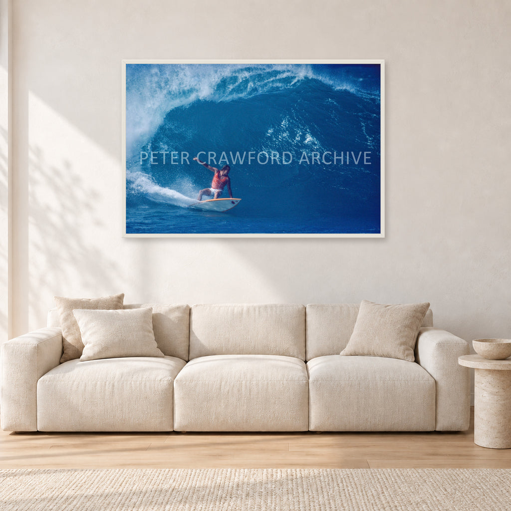 Simon Anderson, Pipeline 1981 by Peter Crawford — 120 × 80 cm, white frame, shown in a light minimalist living room.