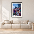 Stubbies Camera Crowd 78 Steve O'Ferral by Peter Crawford — 60 × 90 cm, black frame with white mat, shown in a light minimalist living room.