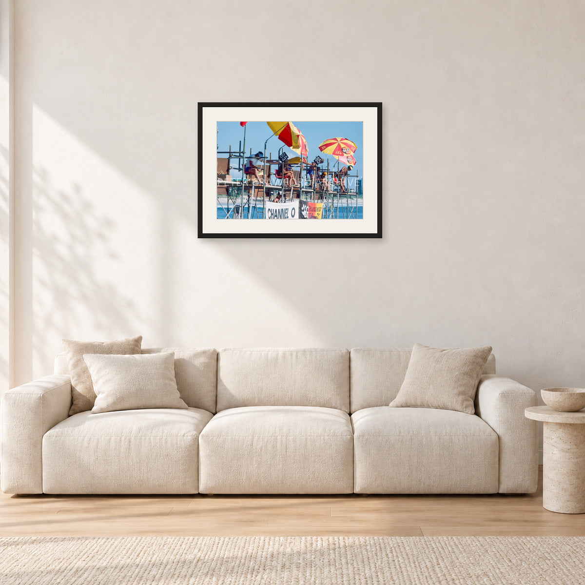 Stubbies Judges 1980 by Peter Crawford — 60 × 40 cm, black frame with white mat, shown in a light minimalist living room.