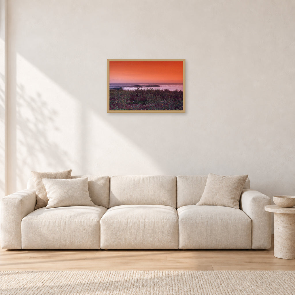 Sumbawa, Indonesia by Peter Crawford — 60 × 40 cm, hayseed frame, shown in a light minimalist living room.