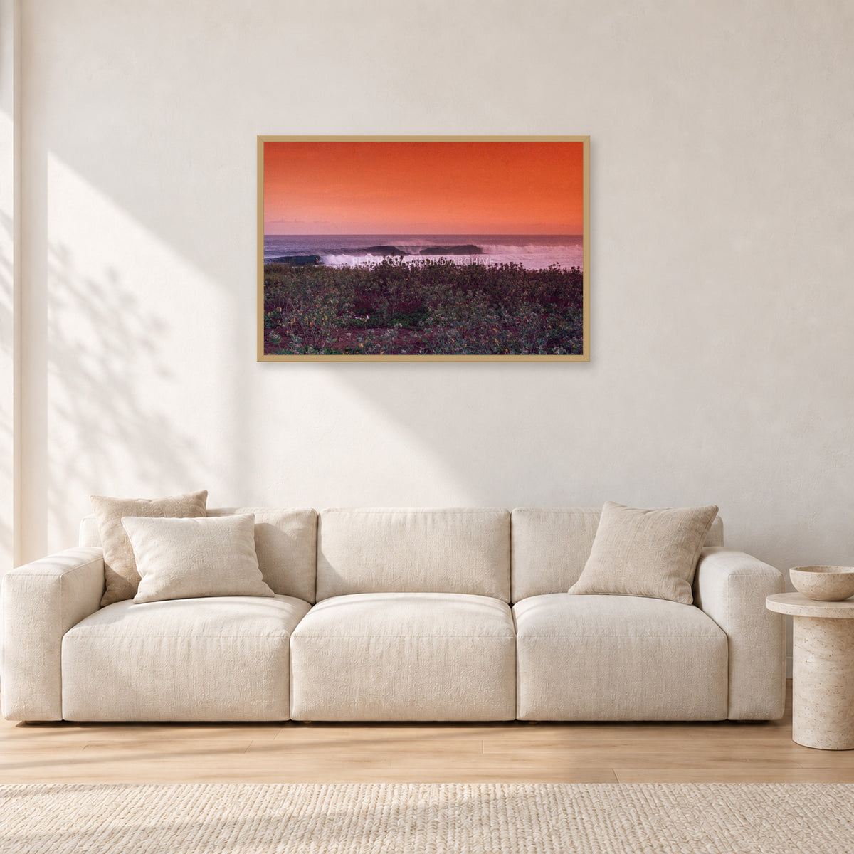 Sumbawa, Indonesia by Peter Crawford — 90 × 60 cm, hayseed frame, shown in a light minimalist living room.