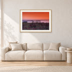 Sumbawa, Indonesia by Peter Crawford — 90 × 60 cm, hayseed frame with white mat, shown in a light minimalist living room.