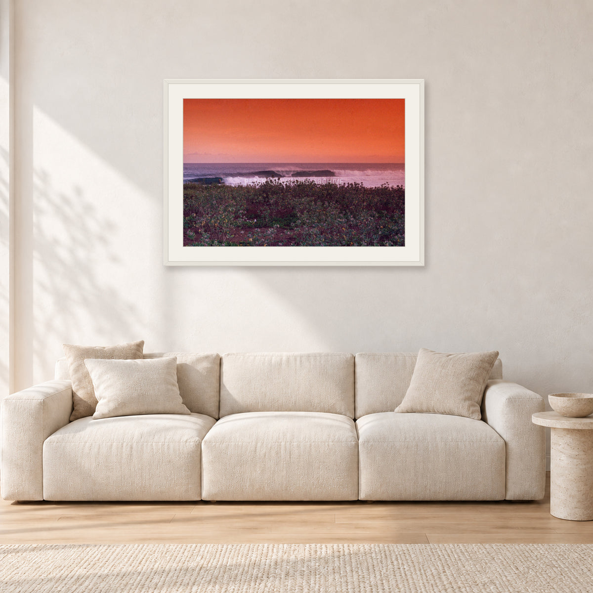 Sumbawa, Indonesia by Peter Crawford — 90 × 60 cm, white frame with white mat, shown in a light minimalist living room.