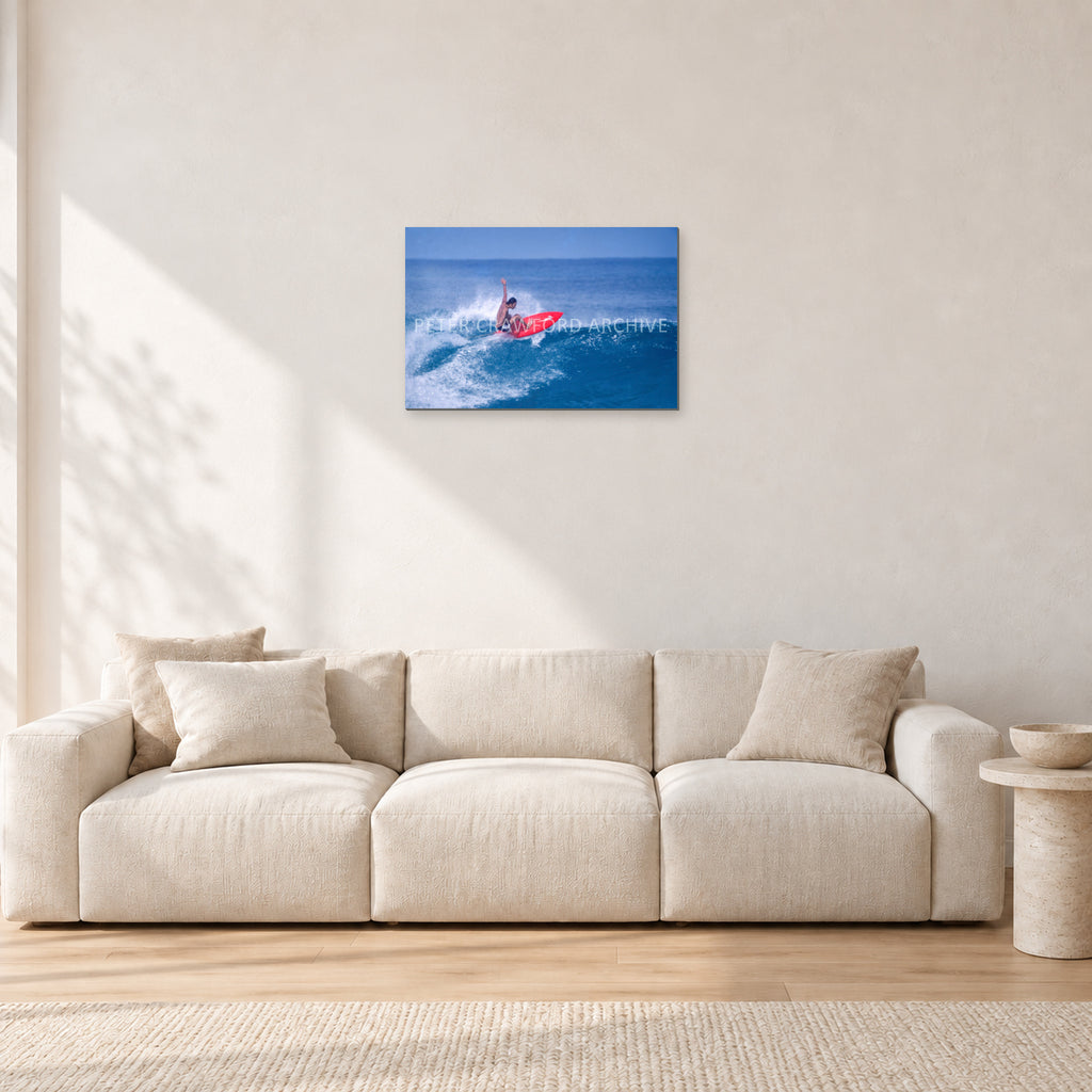 Sunset Beach, Hawaii by Peter Crawford — 60 × 40 cm, aluminium-mounted resin print, shown in a light minimalist living room.