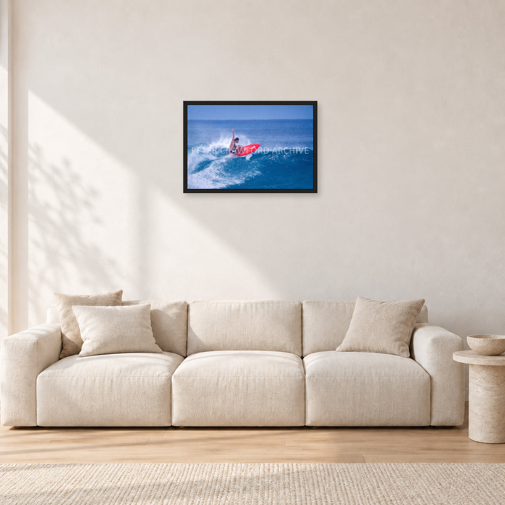 Sunset Beach, Hawaii by Peter Crawford — 60 × 40 cm, black frame, shown in a light minimalist living room.