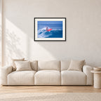 Sunset Beach, Hawaii by Peter Crawford — 60 × 40 cm, black frame with white mat, shown in a light minimalist living room.