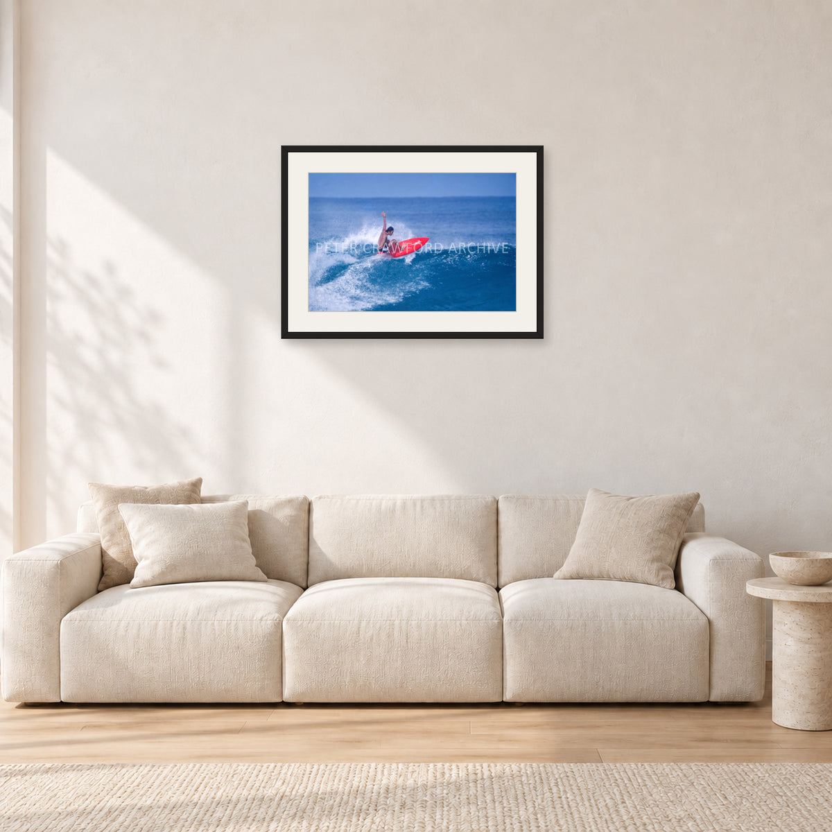 Sunset Beach, Hawaii by Peter Crawford — 60 × 40 cm, black frame with white mat, shown in a light minimalist living room.