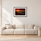 Sunset Favourite by Peter Crawford — 60 × 40 cm, black frame with white mat, shown in a light minimalist living room.