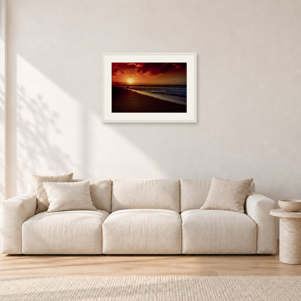 Sunset Favourite by Peter Crawford — 60 × 40 cm, white frame with white mat, shown in a light minimalist living room.