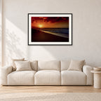 Sunset Favourite by Peter Crawford — 90 × 60 cm, black frame with white mat, shown in a light minimalist living room.