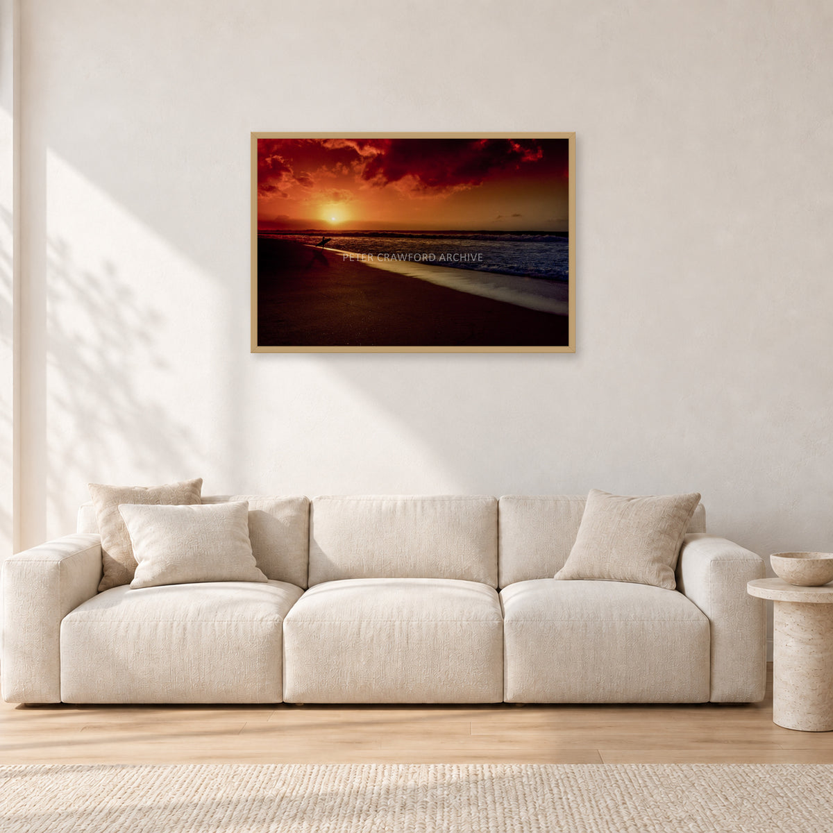 Sunset Favourite by Peter Crawford — 90 × 60 cm, hayseed frame, shown in a light minimalist living room.