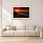 Sunset Favourite by Peter Crawford — 90 × 60 cm, hayseed frame with white mat, shown in a light minimalist living room.