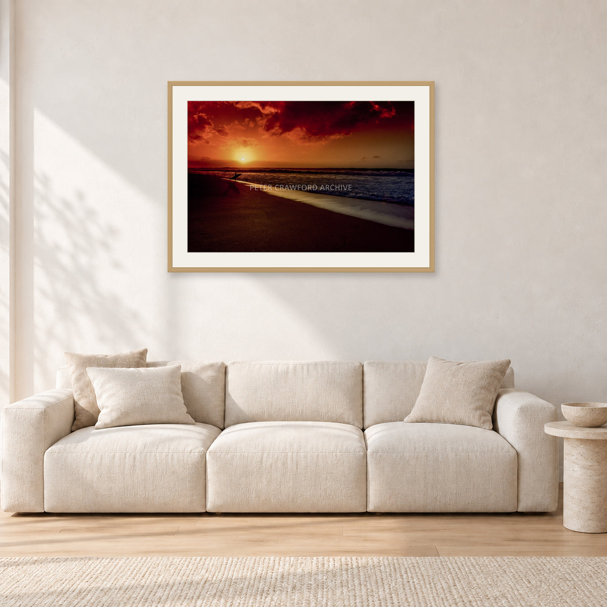 Sunset Favourite by Peter Crawford — 90 × 60 cm, hayseed frame with white mat, shown in a light minimalist living room.