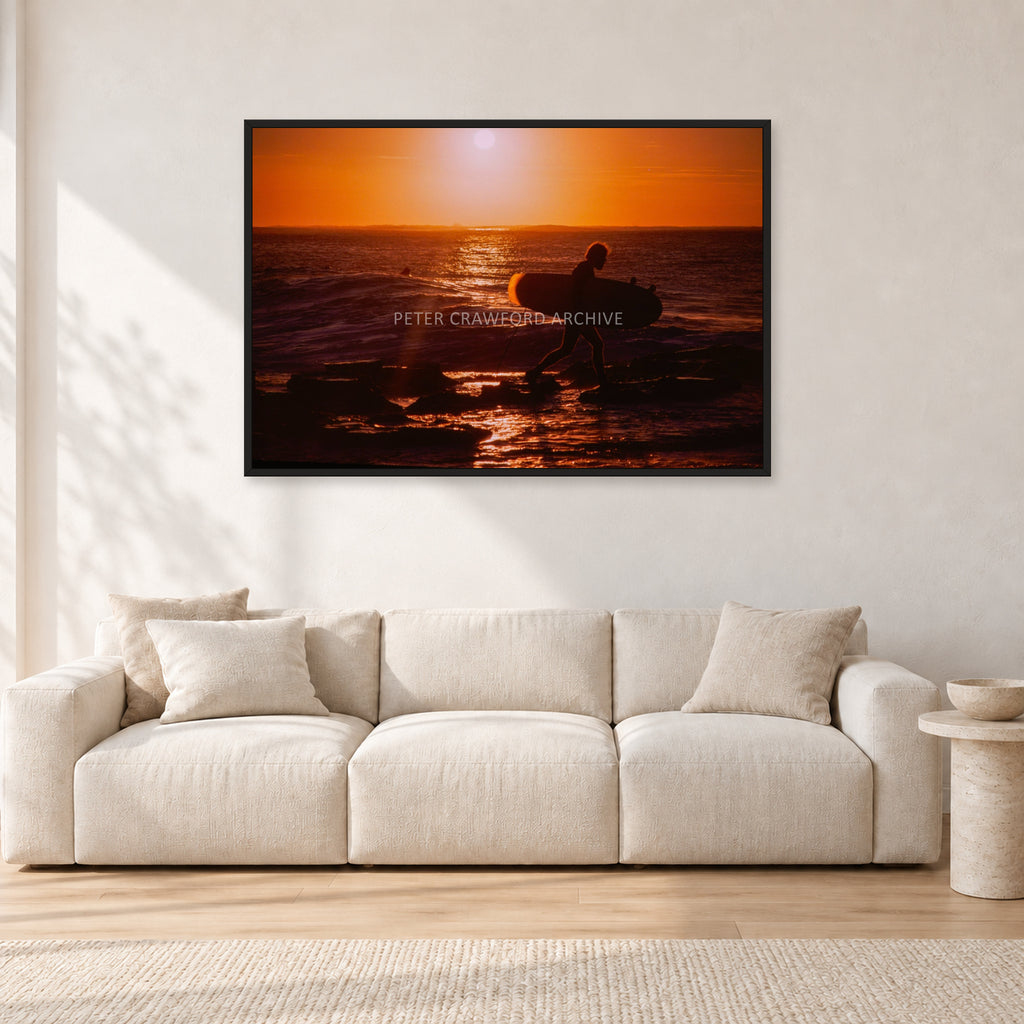 Sunset X1 by Peter Crawford — 120 × 80 cm, black frame, shown in a light minimalist living room.