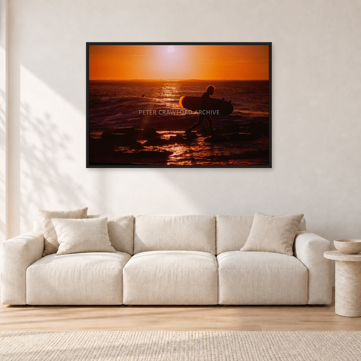 Sunset X1 by Peter Crawford — 120 × 80 cm, black frame, shown in a light minimalist living room.