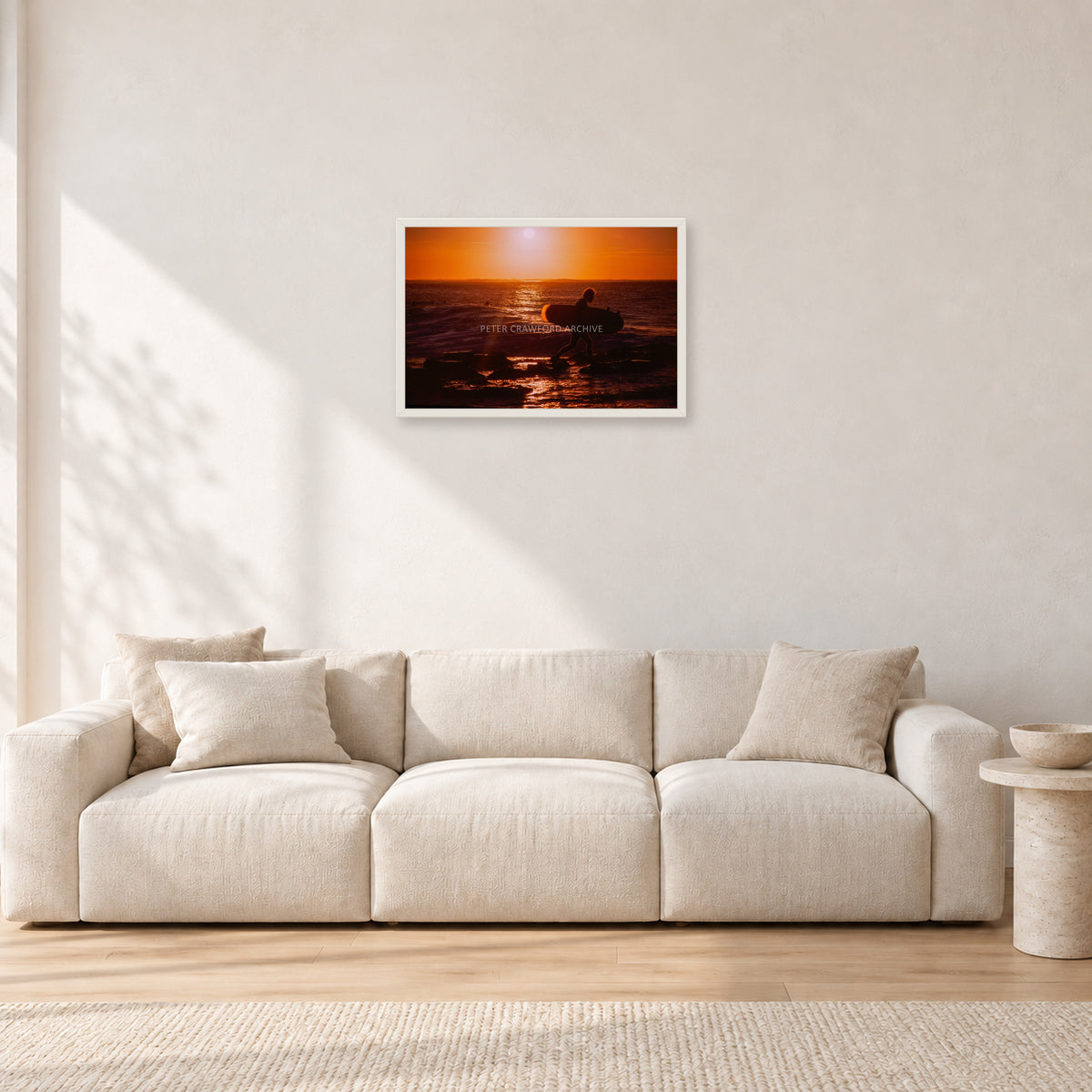 Sunset X1 by Peter Crawford — 60 × 40 cm, white frame, shown in a light minimalist living room.