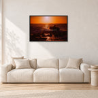 Sunset X1 by Peter Crawford — 90 × 60 cm, black frame, shown in a light minimalist living room.