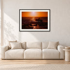 Sunset X1 by Peter Crawford — 90 × 60 cm, black frame with white mat, shown in a light minimalist living room.