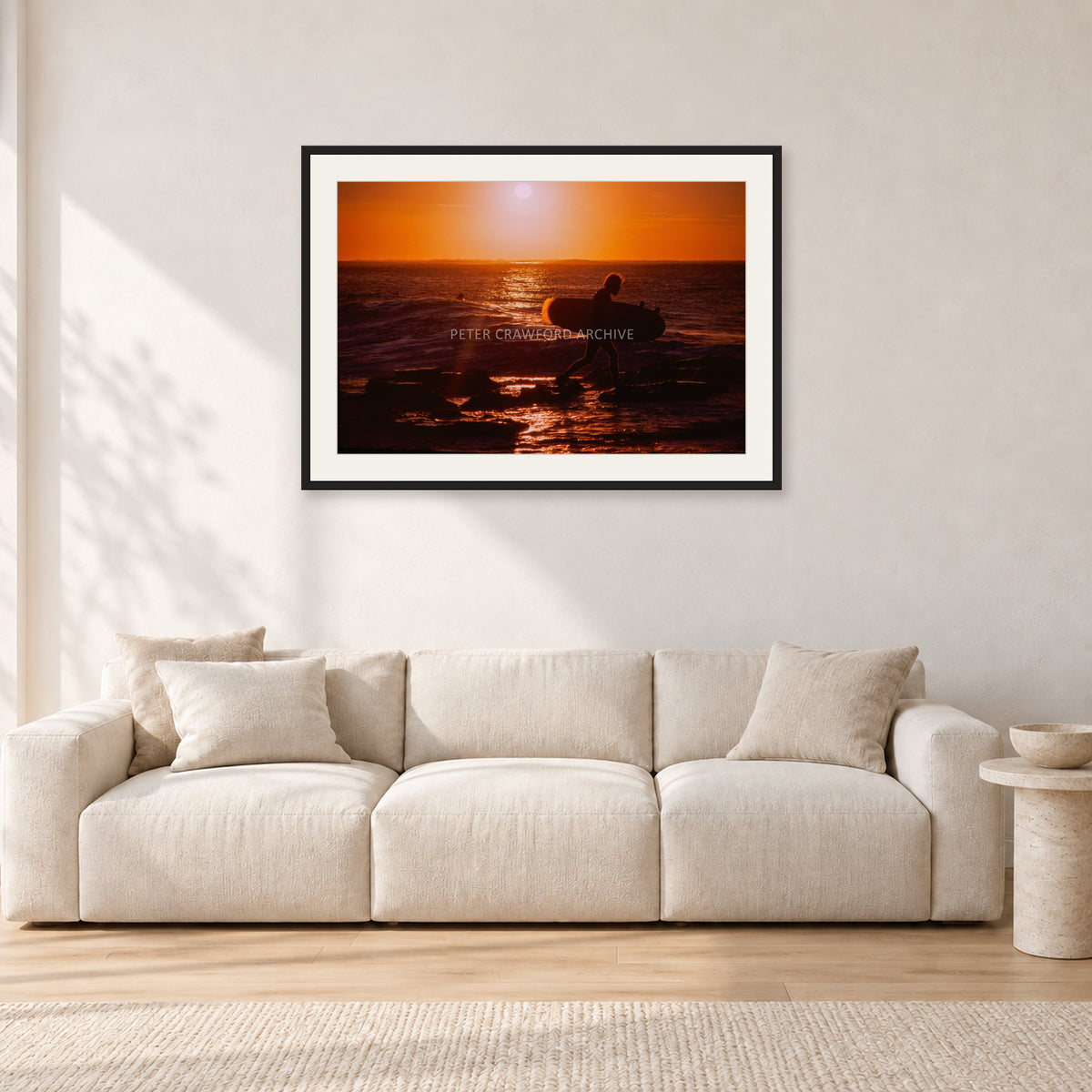 Sunset X1 by Peter Crawford — 90 × 60 cm, black frame with white mat, shown in a light minimalist living room.