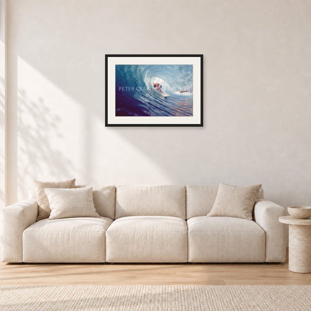 Surf Study 33 by Peter Crawford — 60 × 40 cm, black frame with white mat, shown in a light minimalist living room.