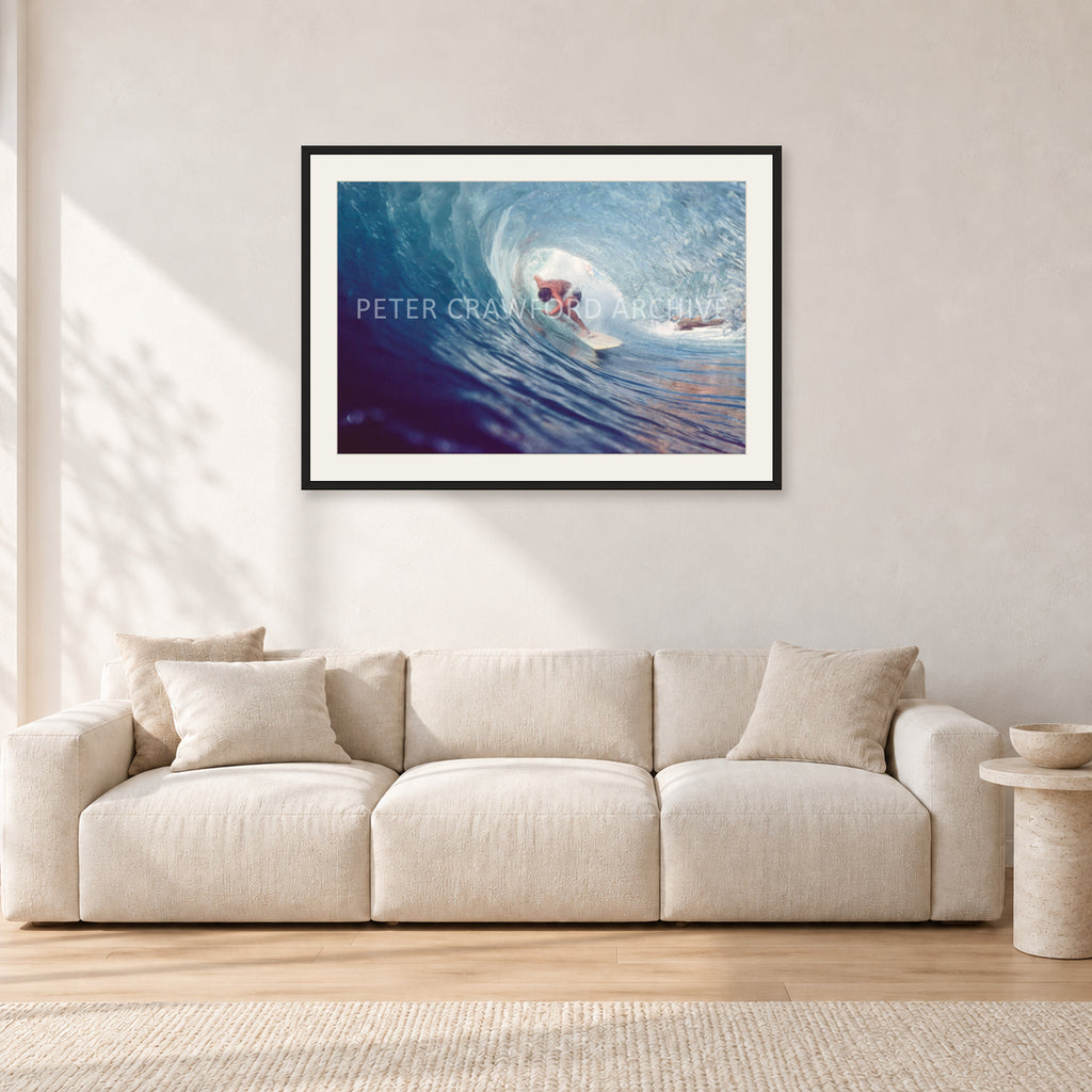 Surf Study 33 by Peter Crawford — 90 × 60 cm, black frame with white mat, shown in a light minimalist living room.