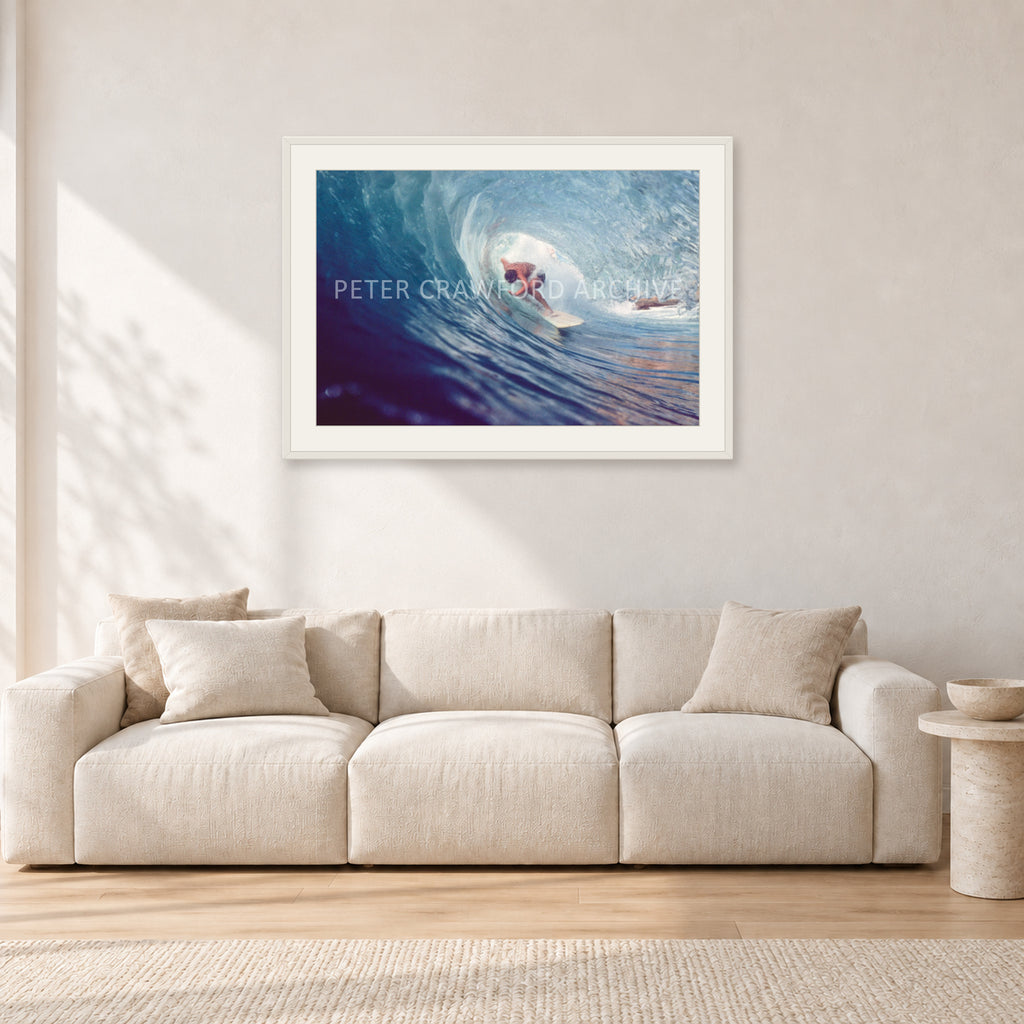 Surf Study 33 by Peter Crawford — 90 × 60 cm, white frame with white mat, shown in a light minimalist living room.