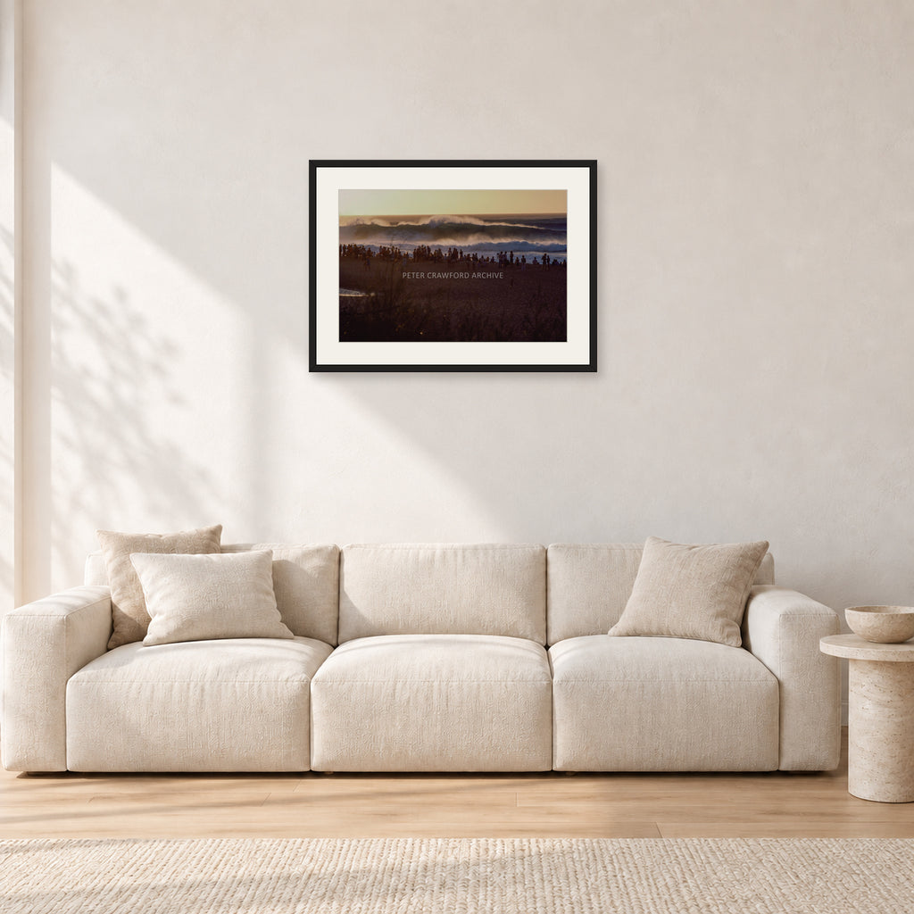 The Big Show, Pipeline 1975 by Peter Crawford — 60 × 40 cm, black frame with white mat, shown in a light minimalist living room.