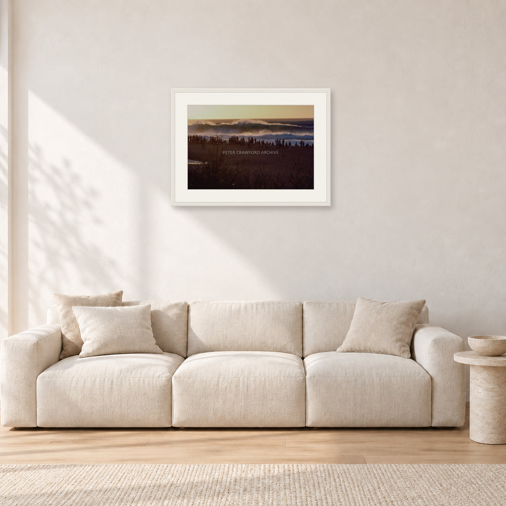 The Big Show, Pipeline 1975 by Peter Crawford — 60 × 40 cm, white frame with white mat, shown in a light minimalist living room.