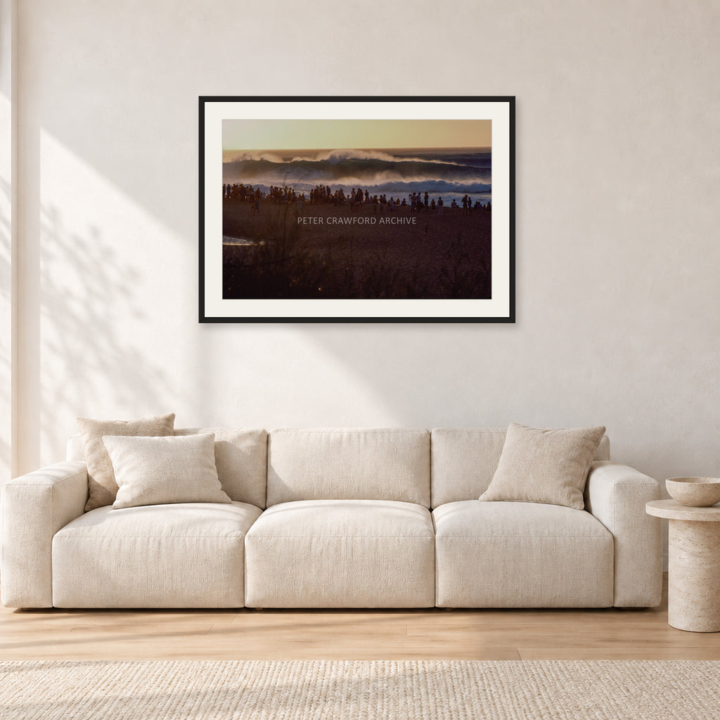 The Big Show, Pipeline 1975 by Peter Crawford — 90 × 60 cm, black frame with white mat, shown in a light minimalist living room.