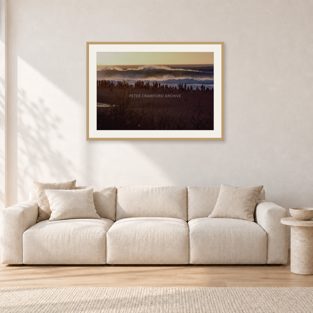 The Big Show, Pipeline 1975 by Peter Crawford — 90 × 60 cm, hayseed frame with white mat, shown in a light minimalist living room.