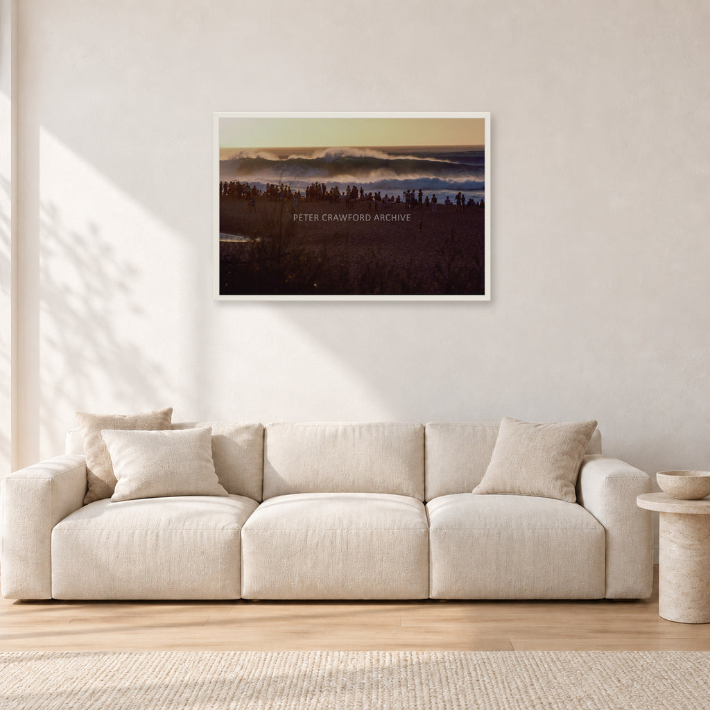 The Big Show, Pipeline 1975 by Peter Crawford — 90 × 60 cm, white frame, shown in a light minimalist living room.