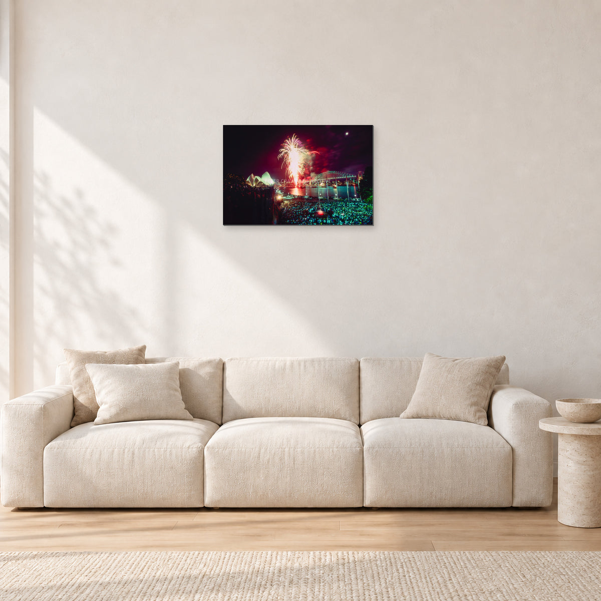 Tom Carroll and Aaron Chang, Waimea 1985 by Peter Crawford — 60 × 40 cm, aluminium-mounted resin print, shown in a light minimalist living room.