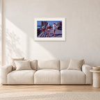 Tom Carroll, Mike Newling and Simon Anderson, Huntington 1984 by Peter Crawford — 60 × 40 cm, white frame with white mat, shown in a light minimalist living room.
