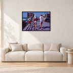 Tom Carroll, Mike Newling and Simon Anderson, Huntington 1984 by Peter Crawford — 90 × 60 cm, black frame, shown in a light minimalist living room.