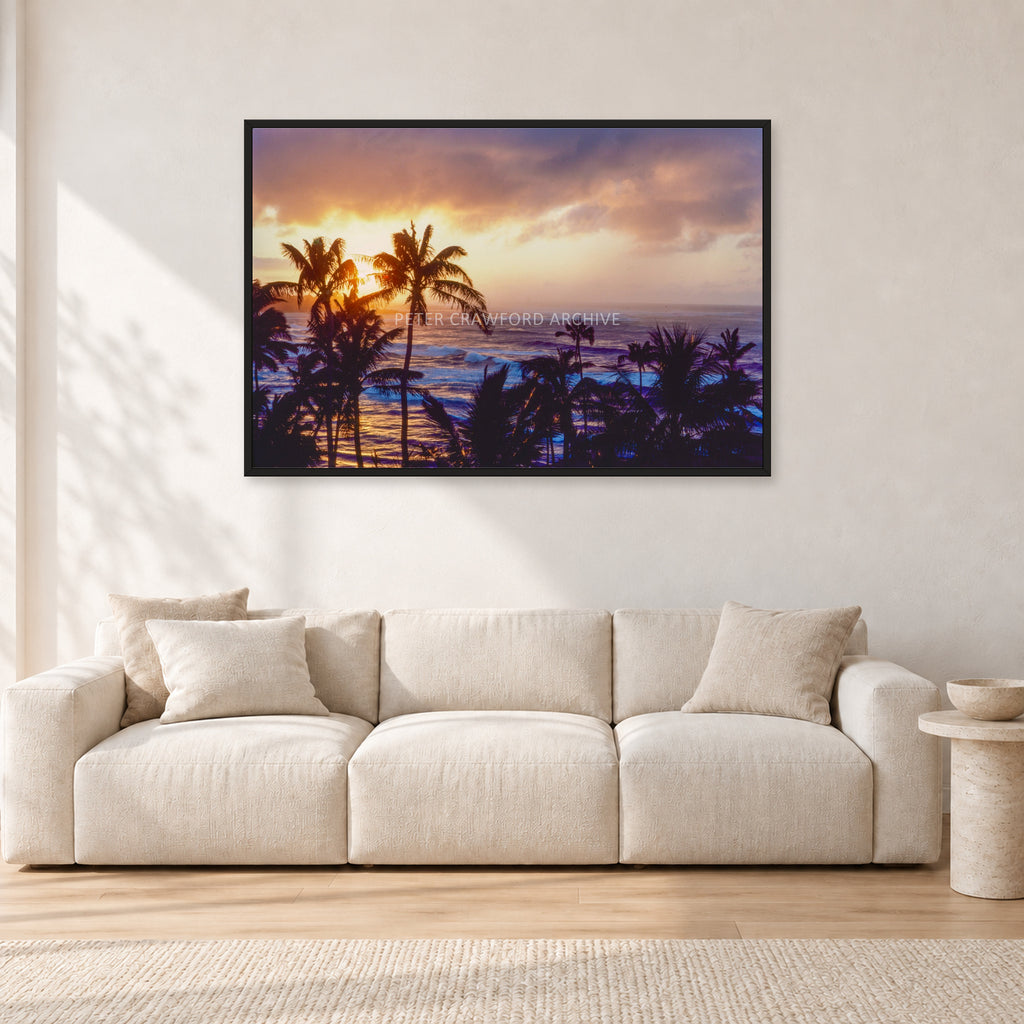 Turtle Bay Dusk by Peter Crawford — 120 × 80 cm, black frame, shown in a light minimalist living room.