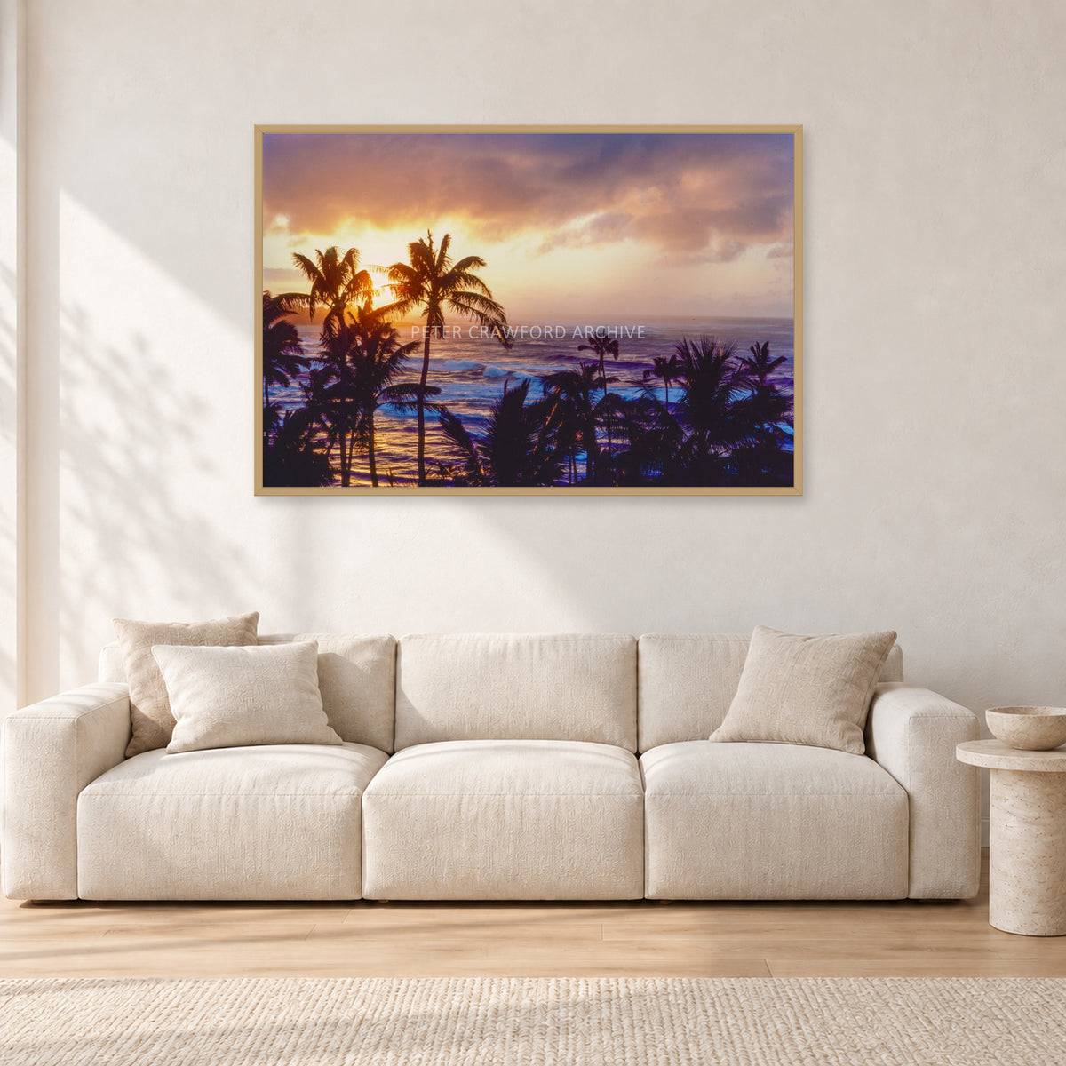 Turtle Bay Dusk by Peter Crawford — 120 × 80 cm, hayseed frame, shown in a light minimalist living room.