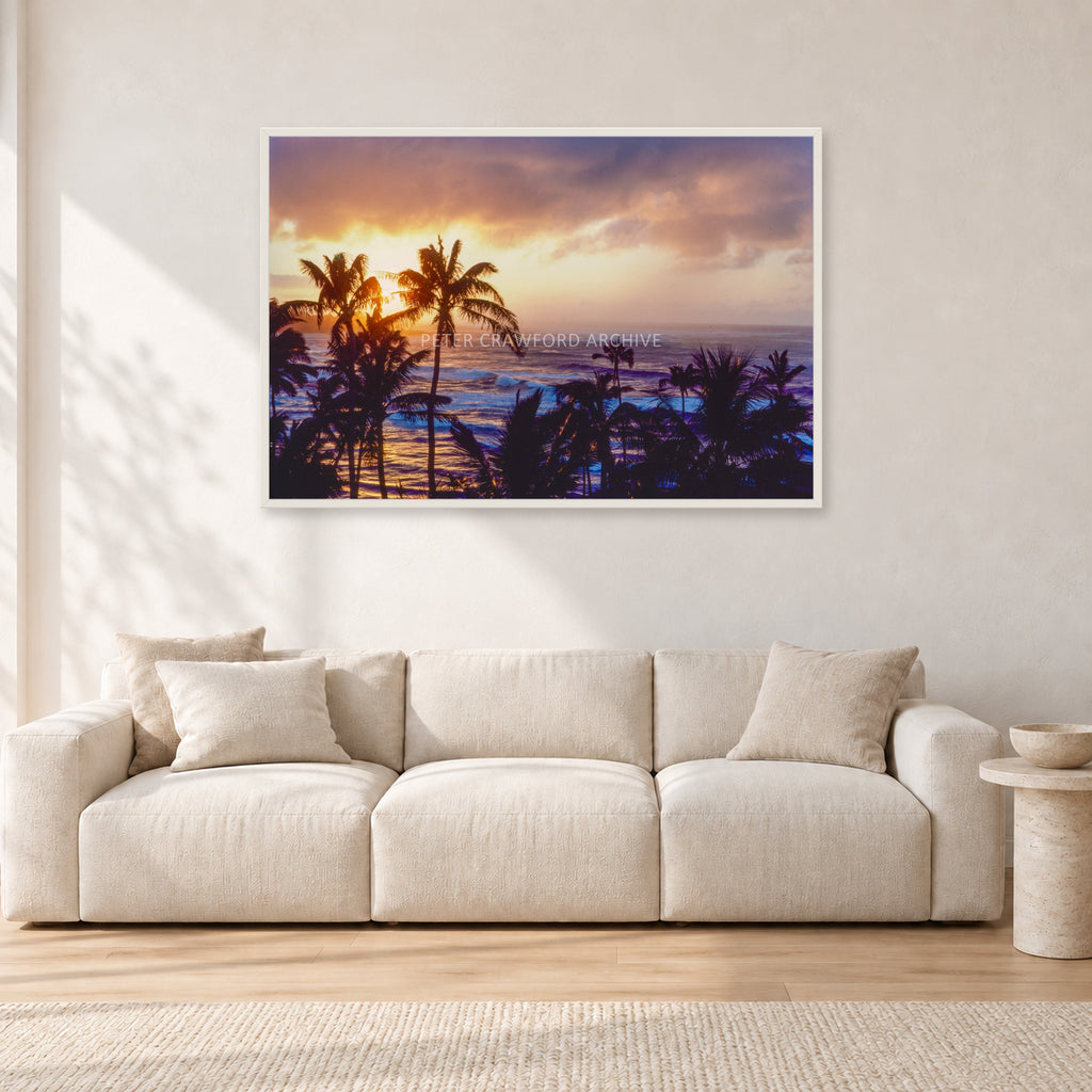 Turtle Bay Dusk by Peter Crawford — 120 × 80 cm, white frame, shown in a light minimalist living room.