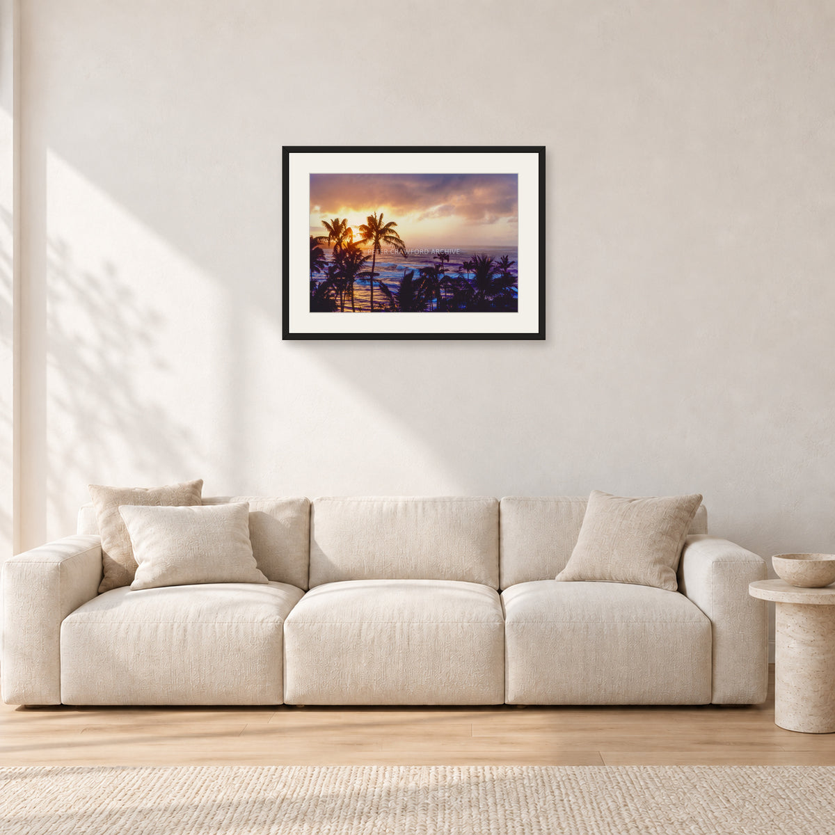 Turtle Bay Dusk by Peter Crawford — 60 × 40 cm, black frame with white mat, shown in a light minimalist living room.