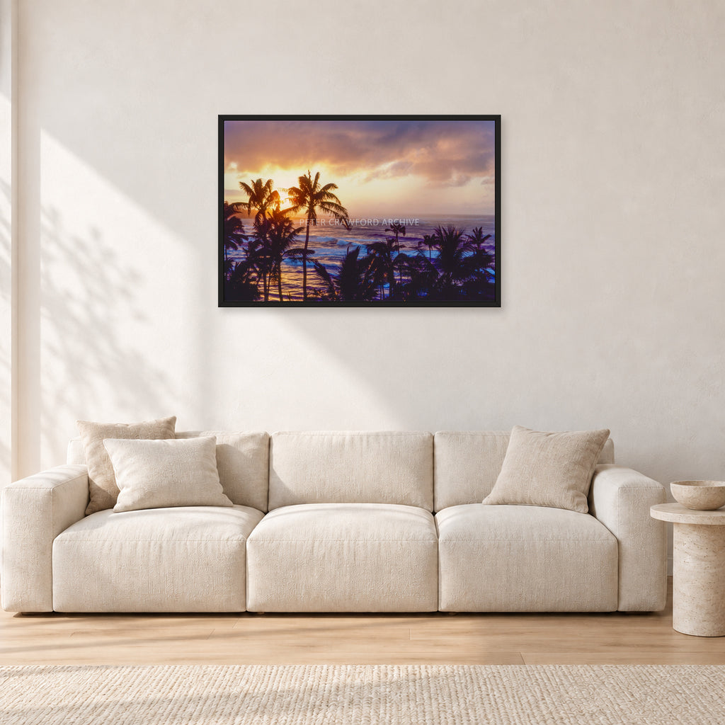 Turtle Bay Dusk by Peter Crawford — 90 × 60 cm, black frame, shown in a light minimalist living room.