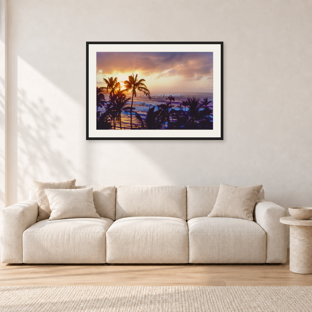 Turtle Bay Dusk by Peter Crawford — 90 × 60 cm, black frame with white mat, shown in a light minimalist living room.