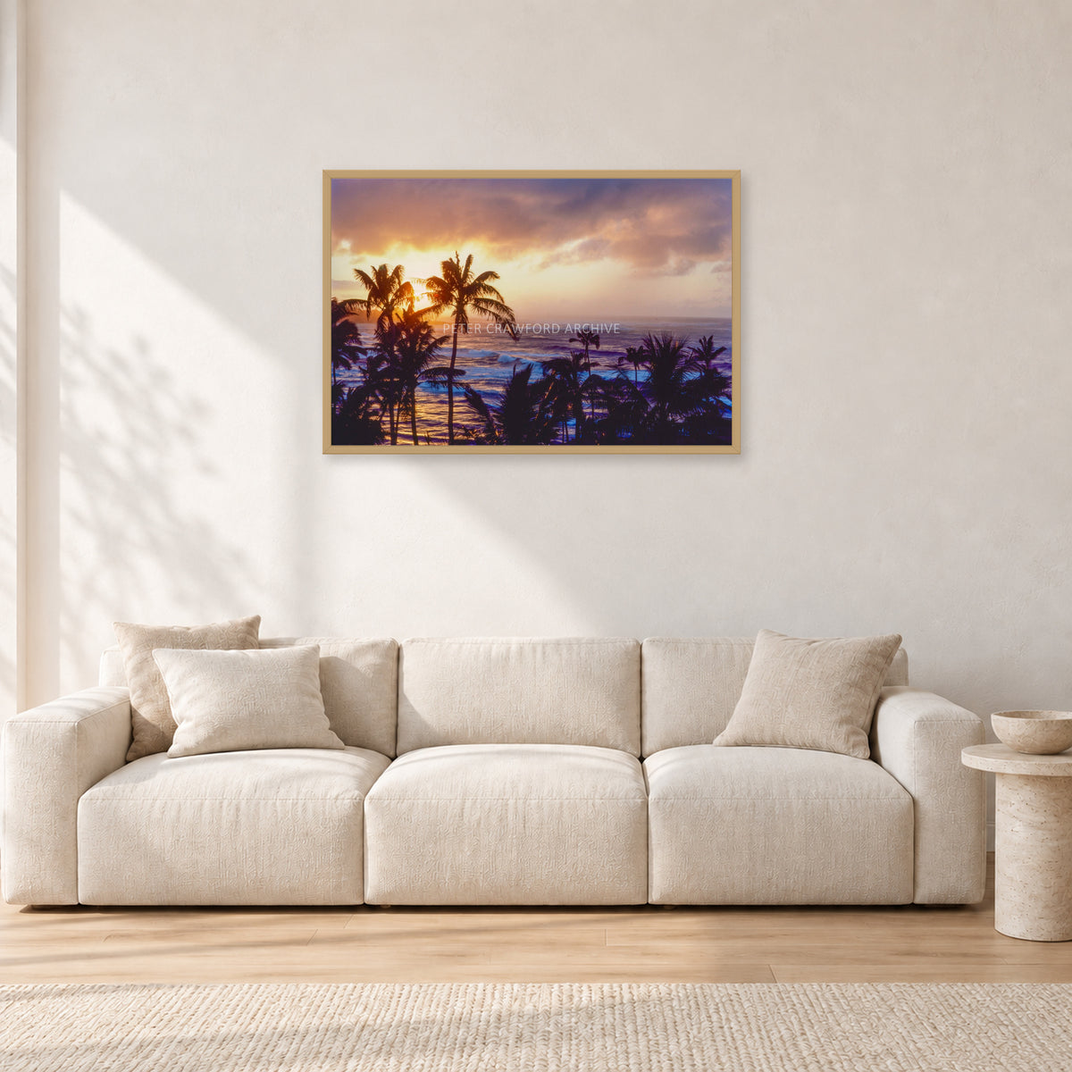 Turtle Bay Dusk by Peter Crawford — 90 × 60 cm, hayseed frame, shown in a light minimalist living room.