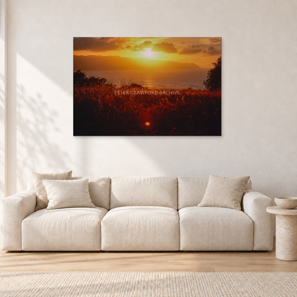 Waimea Dusk by Peter Crawford — 120 × 80 cm, aluminium-mounted resin print, shown in a light minimalist living room.