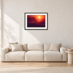 Winter Sun, Collaroy by Peter Crawford — 60 × 40 cm, black frame with white mat, shown in a light minimalist living room.