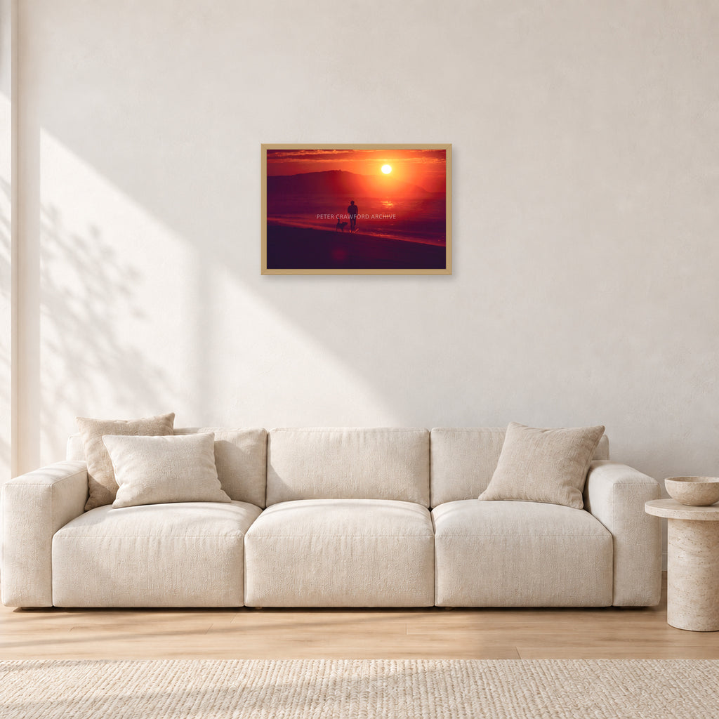 Winter Sun, Collaroy by Peter Crawford — 60 × 40 cm, hayseed frame, shown in a light minimalist living room.